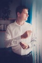 Groom or businessman putting on cuff links Royalty Free Stock Photo