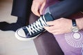 groom or businessman wearing sneakers instead of classic shoes