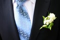 Groom ceremonial suit, boutonniere and tie