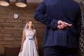 Groom with crosses fingers makes promise to bride