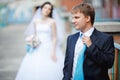 The groom dark blue suit straightens turquoise tie Royalty Free Stock Photo