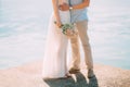 The groom embraces the bride on the beach. Wedding in Montenegro Royalty Free Stock Photo