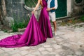 The groom embraces the bride in the old town. Wedding in Montene Royalty Free Stock Photo