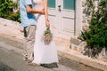 The groom embraces the bride in the old town. Wedding in Montene Royalty Free Stock Photo