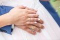 Groom embraces the bride. rings on the hands of newly-married couple Royalty Free Stock Photo