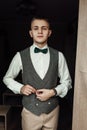 Handsome groom waiting for bride in luxury hotel room, morning b Royalty Free Stock Photo