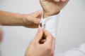 Groom getting ready for the wedding ceremony, putting on cuff-links Royalty Free Stock Photo