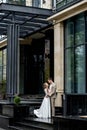 The groom gives his hand to the bride walking down the stairs. Shooting on the wedding day Royalty Free Stock Photo