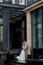 The groom gives his hand to the bride walking down the stairs. Shooting on the wedding day Royalty Free Stock Photo