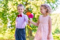 Groom gives a little girl a bouquet Royalty Free Stock Photo