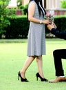 Groom giving bouquet to his bride