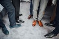 Groom and groomsmen men in blue suits standing in group with closeup of shoes and feet Royalty Free Stock Photo