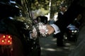 Groom hand opening limousine door