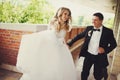 Groom has fun while siitting with a bride at the piano Royalty Free Stock Photo