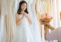 Groom hiding flower behind back in order to surprise bride,Woman positive emotion and face astonished,Romantic and sweet moment