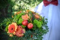 Groom holding bouquet Royalty Free Stock Photo