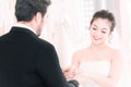 Groom holding hands of Bride in Wedding suits Ceremony