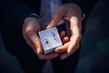 Groom holding small box with gold wedding rings. Men`s hands close up, top view. Concept of wedding day. Accessories for Royalty Free Stock Photo