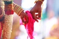 Groom holds bride hand in south Indian traditional wedding ceremony