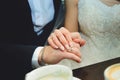 The groom holds the bride by the hand on the wedding day. Close-up Royalty Free Stock Photo