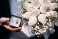 decorative box with wedding rings and a beautiful wedding bouquet of roses for the bride Royalty Free Stock Photo
