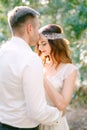 The groom hugs the bride and gently kisses her on the forehead Royalty Free Stock Photo