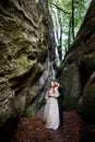 Groom kisses bride from behind Royalty Free Stock Photo