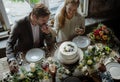 Groom Kissing Bride Hand on Wedding Reception