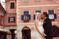 Groom kissing his bride in old city Royalty Free Stock Photo