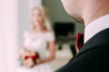 The groom look at his beautiful bride. Wedding. View from behind the shoulder. Selective focus