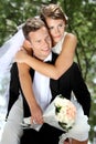 Groom pickaback his bride Royalty Free Stock Photo