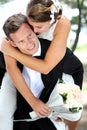 Groom pickaback his bride Royalty Free Stock Photo