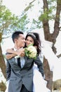 Groom piggybacking his bride Royalty Free Stock Photo