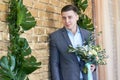 Groom preparing for the wedding. Future husband is waiting for his future wife.A man in a wedding suit poses for the photographer Royalty Free Stock Photo