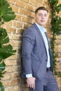 Groom preparing for the wedding. Future husband is waiting for his future wife.A man in a wedding suit poses for the photographer Royalty Free Stock Photo