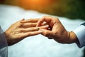 Groom put gold wedding ring on the bride`s finger, close-up. The wedding ceremony, exchange of rings Royalty Free Stock Photo