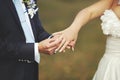 Groom put a wedding ring on finger of his lovely bride Royalty Free Stock Photo