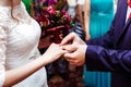 Groom puts wedding ring on bride`s finger Royalty Free Stock Photo