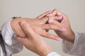 The Groom is Putting the Wedding Ring on the Bride's Left Ring Finger Royalty Free Stock Photo