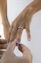 Groom putting wedding ring on brides finger (close-up) Royalty Free Stock Photo