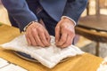 Groom`s hands take rings Royalty Free Stock Photo