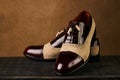 Groom`s wedding shoes on a dark wooden box, close-up Royalty Free Stock Photo