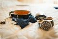 Groom set clothes. Wedding rings, shoes, cufflinks and bow tie Royalty Free Stock Photo