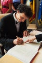 Groom signing papers Royalty Free Stock Photo