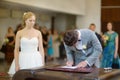 Groom signing a wedding contract Royalty Free Stock Photo