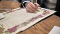 The groom signs the ketubah