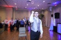 Groom tossing garter