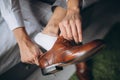 Groom is wearing shoes indoors. Male portrait of handsome guy. Beautiful model boy in colorful wedding clothes. Man is Royalty Free Stock Photo