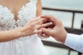 The groom wears the bride a wedding ring at the ceremony Royalty Free Stock Photo