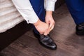 Groom wears nice shoes and tying shoelaces Royalty Free Stock Photo